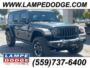 2024 Jeep Wrangler 4-door Rubicon 4xe in a Granite Crystal Metallic Clear Coat exterior color and Blackinterior. Lampe Chrysler Dodge Jeep RAM 559-471-3085 pixelmotiondemo.com 