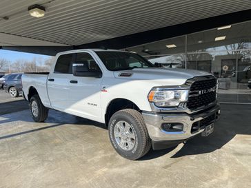 2024 RAM 2500 Big Horn Crew Cab 4x4 6'4' Box in a Bright White Clear Coat exterior color. Shields Motor Company Inc (620) 902-2035 shieldsmotorchryslerdodgejeep.com 