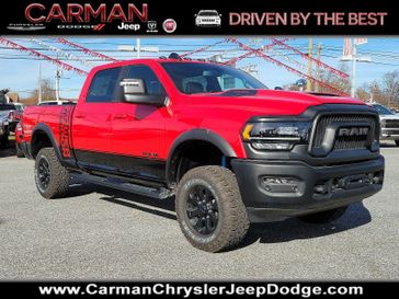 2024 RAM 2500 Power Wagon Crew Cab 4x4 6'4' Box in a Flame Red Clear Coat exterior color and Black - ALX9interior. Carman Chrysler Jeep Dodge Ram 302-317-2378 carmanchryslerjeepdodge.com 