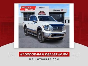 2023 Nissan Titan Platinum Reserve in a Pearl White Metallic exterior color and Black/Browninterior. Melloy Dodge RAM FIAT 505-588-4459 melloydodge.com 