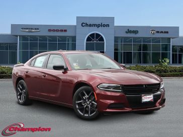 2023 Dodge Charger SXT Rwd in a Octane Red exterior color and HOUNDSTOOTHinterior. Champion Chrysler Jeep Dodge Ram 800-549-1084 pixelmotiondemo.com 