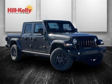 2023 Jeep Gladiator Willys 4x4 in a Granite Crystal Metallic Clear Coat exterior color and Blackinterior. Hill-Kelly Dodge (850) 786-2130 hillkellydodge.com 