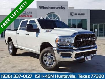 2024 RAM 2500 Tradesman Crew Cab 4x4 6'4' Box in a Bright White Clear Coat exterior color and Blackinterior. Wischnewsky Dodge 936-755-5310 wischnewskydodge.com 