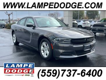 2021 Dodge Charger SXT in a Granite Pearl Coat exterior color and Blackinterior. Lampe Chrysler Dodge Jeep RAM 559-471-3085 pixelmotiondemo.com 