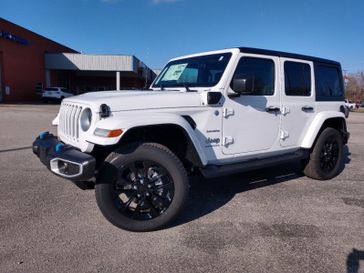 2023 Jeep Wrangler Sahara 4xe in a Bright White Clear Coat exterior color and Blackinterior. Weeks Chrysler - Jeep Dodge 618-603-2267 weekschryslerjeep.com 