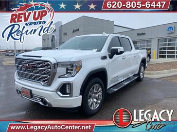 2019 GMC Sierra 1500 Denali in a White Frost Tri Coat exterior color and Dark Walnut/Dark Ash Greyinterior. Legacy Auto Center 620-315-9264 legacyautocenter.net 