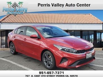2023 Kia Forte LXS in a Currant Red exterior color and Blackinterior. Perris Valley Chrysler Dodge Jeep Ram 951-355-1970 perrisvalleydodgejeepchrysler.com 