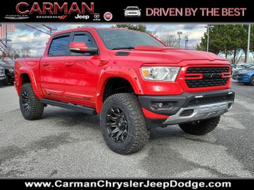 2022 RAM 1500 Big Horn Crew Cab 4x4 5'7' Box in a Flame Red Clear Coat exterior color and Blackinterior. Carman Chrysler Jeep Dodge Ram 302-317-2378 carmanchryslerjeepdodge.com 