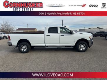 2024 RAM 3500 Tradesman in a Bright White Clear Coat exterior color and Blackinterior. Cornhusker Auto Center 402-866-8665 cornhuskerautocenter.com 