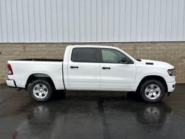 2024 RAM 1500 Tradesman Crew Cab 4x4 5'7' Box in a Bright White Clear Coat exterior color and Blackinterior. Wilmington Auto Center Chrysler Dodge Jeep Ram (937) 556-6430 wilmingtonautocentercdjr.com 