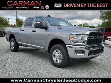 2024 RAM 2500 Tradesman Crew Cab 4x4 6'4' Box in a Billet Silver Metallic Clear Coat exterior color and Black - V9X9interior. Carman Chrysler Jeep Dodge Ram 302-317-2378 carmanchryslerjeepdodge.com 