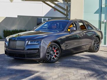 2024 Rolls-Royce Black Badge Ghost  in a Gunmetal exterior color and Forge Yellowinterior. ROLLS-ROYCE MOTOR CARS ORANGE COUNTY (949) 523-3061 rolls-roycemotorcarsoc.com 