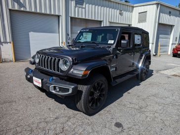 2024 Jeep Wrangler 4xe 4-Door Sahara in a Granite Crystal Metallic Clear Coat exterior color and Blackinterior. Don White's Timonium Chrysler Dodge Jeep Ram 410-881-5409 donwhites.com 