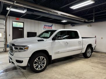 Used 2022 RAM 1500 Limited in a Ivory White Tri Coat Pearl Coat exterior color and Indigo/Sea Saltinterior. Jensen Chrysler Dodge Jeep Ram 507-354-0542 jensenchryslerdodgejeepram.com 