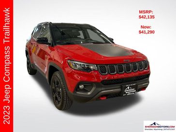 2023 Jeep Compass Trailhawk 4x4 in a Redline Pearl Coat exterior color and Ruby Red/Blackinterior. Sheridan Motors CDJR 307-218-2217 sheridanmotor.com 