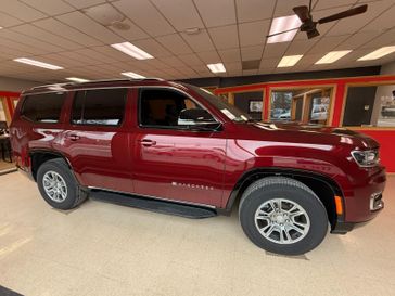2024 Jeep Wagoneer 4x4 in a Velvet Red Pearl Coat exterior color. Hometown Motors of Rockwell City 712-220-7644 hometownmotorsrc.com 
