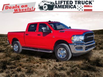 2024 RAM 3500 Tradesman in a Flame Red Clear Coat exterior color and Blackinterior. Lifted Truck America 888-267-0644 liftedtruckamerica.com 