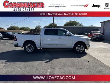 2023 RAM 1500 Limited Crew Cab 4x4 5'7' Box in a Ivory White Tri Coat Pearl Coat exterior color and Blackinterior. Cornhusker Auto Center 402-866-8665 cornhuskerautocenter.com 