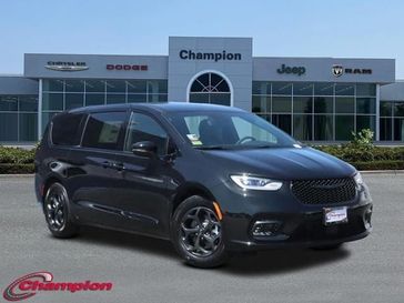 2023 Chrysler Pacifica Plug-in Hybrid Touring L in a Brilliant Black Crystal Pearl Coat exterior color and CAPRICE LEATHERinterior. Champion Chrysler Jeep Dodge Ram 800-549-1084 pixelmotiondemo.com 