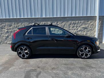 2023 Kia Niro EX Touring in a Aurora Black Pearl exterior color and Medium Grayinterior. Wilmington Auto Center Chrysler Dodge Jeep Ram (937) 556-6430 wilmingtonautocentercdjr.com 