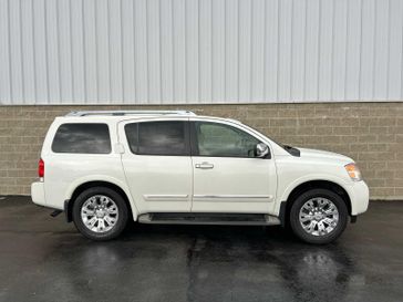 2015 Nissan Armada Platinum in a Pearl White exterior color and Almondinterior. Wilmington Auto Center Chrysler Dodge Jeep Ram (937) 556-6430 wilmingtonautocentercdjr.com 