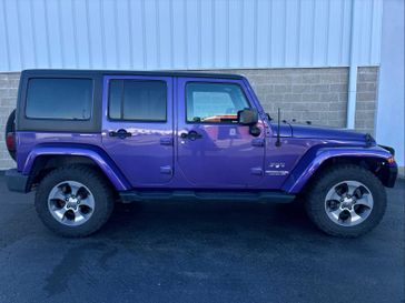 2018 Jeep Wrangler JK Unlimited Sahara in a Xtreme Purple Pearl Coat exterior color and Blackinterior. Wilmington Auto Center Chrysler Dodge Jeep Ram (937) 556-6430 wilmingtonautocentercdjr.com 