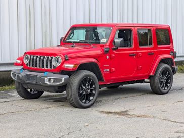 2024 Jeep Wrangler 4-door Sahara 4xe in a Firecracker Red Clear Coat exterior color and Blackinterior. Brattleboro CDJR 802-251-1111 brattleborocdjr.com 