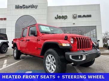 2023 Jeep Gladiator Sport S 4x4 in a Firecracker Red Clear Coat exterior color and Blackinterior. McCarthy Jeep Ram 816-434-0674 mccarthyjeepram.com 