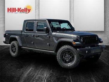 2024 Jeep Gladiator Willys 4x4 in a Granite Crystal Metallic Clear Coat exterior color. Hill-Kelly Dodge (850) 786-2130 hillkellydodge.com 