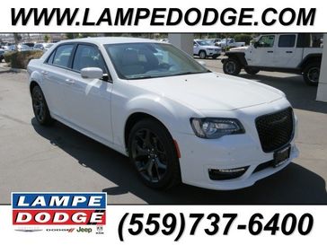 2023 Chrysler 300 Touring L Rwd in a Bright White exterior color. Lampe Chrysler Dodge Jeep RAM 559-471-3085 pixelmotiondemo.com 