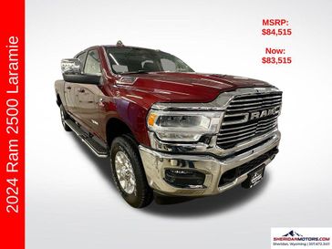 2024 RAM 2500 Laramie Mega Cab 4x4 6'4' Box in a Delmonico Red Pearl Coat exterior color and Blackinterior. Sheridan Motors CDJR 307-218-2217 sheridanmotor.com 