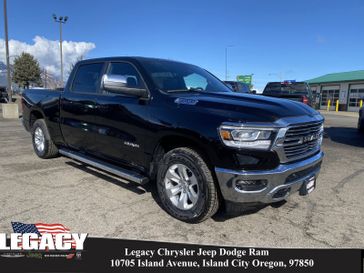 2024 RAM 1500 Laramie Crew Cab 4x4 6'4' Box in a Diamond Black Crystal Pearl Coat exterior color and Blackinterior. Legacy Chrysler Jeep Dodge RAM 541-663-4885 legacychryslerjeepdodgeram.com 