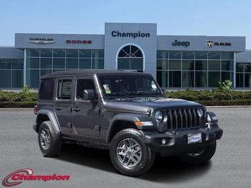 2024 Jeep Wrangler 4-door Sport S in a Granite Crystal Metallic Clear Coat exterior color and CLOTHinterior. Champion Chrysler Jeep Dodge Ram 800-549-1084 pixelmotiondemo.com 