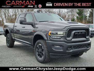 2024 RAM 2500 Rebel Crew Cab 4x4 6'4' Box in a Granite Crystal Metallic Clear Coat exterior color and Black - ALX9interior. Carman Chrysler Jeep Dodge Ram 302-317-2378 carmanchryslerjeepdodge.com 