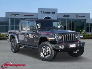 2024 Jeep Gladiator Rubicon 4x4 in a Granite Crystal Metallic Clear Coat exterior color and CLOTHinterior. Champion Chrysler Jeep Dodge Ram 800-549-1084 pixelmotiondemo.com 