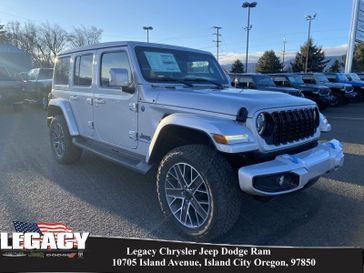 2024 Jeep Wrangler 4-door High Altitude 4xe in a Silver Zynith Clear Coat exterior color. Legacy Chrysler Jeep Dodge RAM 541-663-4885 legacychryslerjeepdodgeram.com 