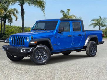 Used 2023 Jeep Gladiator Sport 4x4 in a Hydro Blue Pearl Coat exterior color and Blackinterior. Southbay Chrysler Jeep Dodge Ram (424) 404-5521 pixelmotiondemo.com 