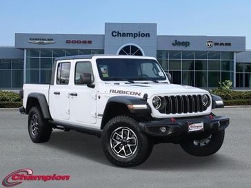 2024 Jeep Gladiator Rubicon 4x4 in a Bright White Clear Coat exterior color and CLOTHinterior. Champion Chrysler Jeep Dodge Ram 800-549-1084 pixelmotiondemo.com 