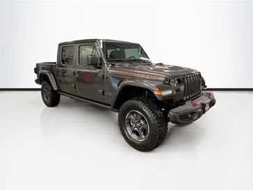 2023 Jeep Gladiator Rubicon 4x4 in a Granite Crystal Metallic Clear Coat exterior color and Blackinterior. Sheridan Motors CDJR 307-218-2217 sheridanmotor.com 