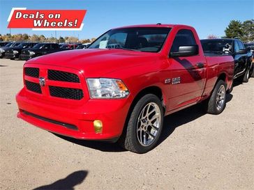 2014 RAM 1500 Express in a Flame Red Clear Coat exterior color and Blackinterior. Melloy Dodge RAM FIAT 505-588-4459 melloydodge.com 