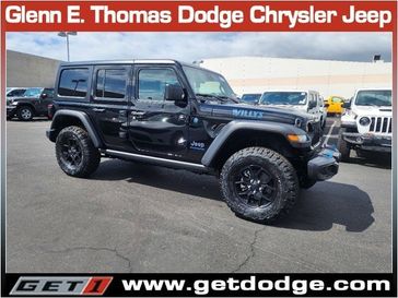 2024 Jeep Wrangler 4-door Willys 4xe in a Black Clear Coat exterior color and Blackinterior. Glenn E Thomas 100 Years Of Excellence (866) 340-5075 getdodge.com 