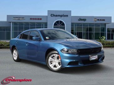 2021 Dodge Charger SXT in a Frostbite exterior color and Blackinterior. Champion Chrysler Jeep Dodge Ram 800-549-1084 pixelmotiondemo.com 