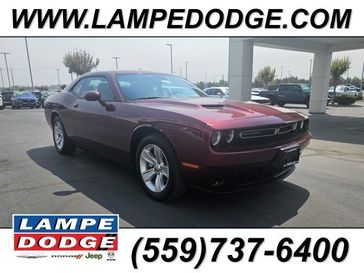 2023 Dodge Challenger SXT in a Octane Red exterior color and Blackinterior. Lampe Chrysler Dodge Jeep RAM 559-471-3085 pixelmotiondemo.com 