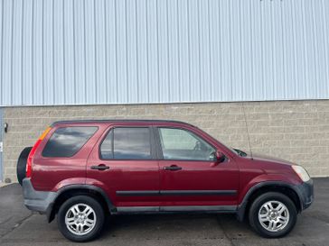 2003 Honda CR-V EX in a Chianti Red Pearl exterior color and Saddleinterior. Wilmington Auto Center Chrysler Dodge Jeep Ram (937) 556-4751 wilmingtonautocentercdjr.com 