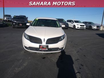 2014 Lincoln MKS  in a White exterior color. Sahara Motors Inc 435-500-5052 saharamotorschryslerdodgejeep.com 