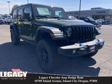2024 Jeep Wrangler 4-door Willys 4xe in a Sarge Green Clear Coat exterior color and Blackinterior. Legacy Chrysler Jeep Dodge RAM 541-663-4885 legacychryslerjeepdodgeram.com 