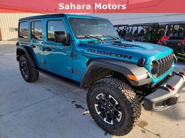 2024 Jeep Wrangler 4-door Rubicon in a Bikini Pearl Coat exterior color. Sahara Motors Ely LLC 775-251-8145 saharamotorsely.com 