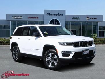 2024 Jeep Grand Cherokee 4xe in a Bright White Clear Coat exterior color and CAPRI LEATHEREinterior. Champion Chrysler Jeep Dodge Ram 800-549-1084 pixelmotiondemo.com 