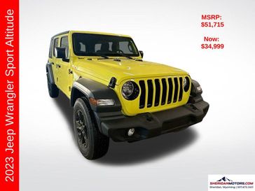 2023 Jeep Wrangler 4-door Sport Altitude 4x4 in a High Velocity Clear Coat exterior color and Blackinterior. Sheridan Motors CDJR 307-218-2217 sheridanmotor.com 