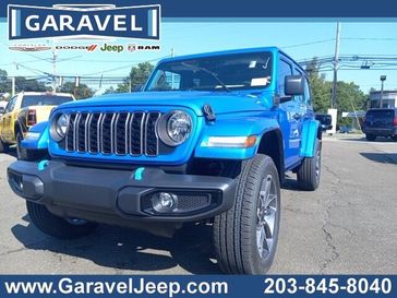 2024 Jeep Wrangler 4-door Sport S 4xe in a Hydro Blue Pearl Coat exterior color and Blackinterior. Garavel Jeep 475-258-7987 norwalkjeep.com 